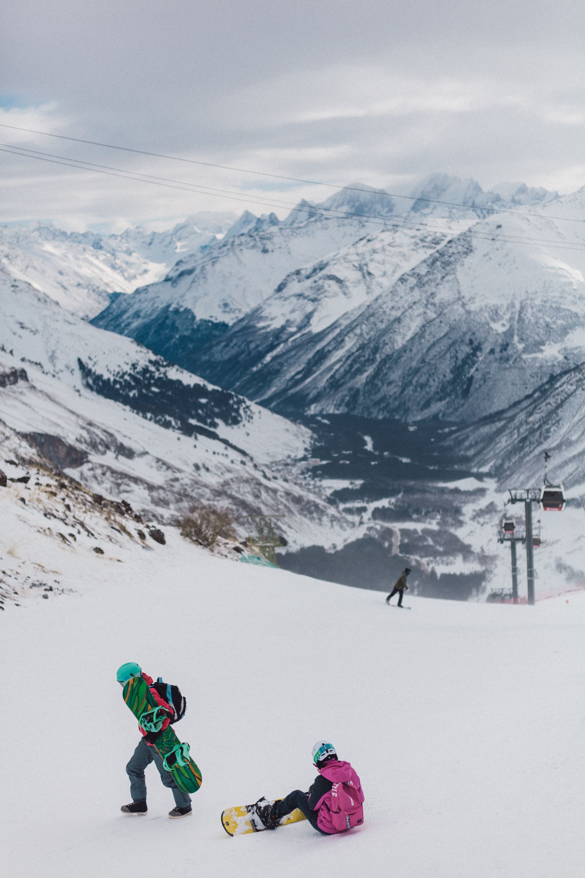 A snowboarder carving through fresh snow